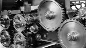 Close-up of interlocking metal gears in an industrial machine